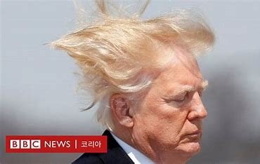 Trump with hair blowing in the wind, captured by BBC News